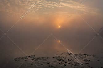 Lake with the fog at sunrise
