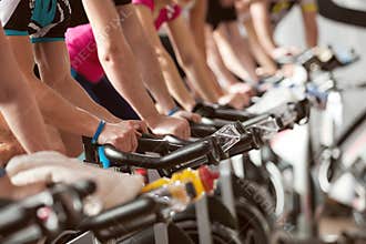 Gym shot - people cycling; spinning class