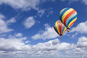 Two Hot Air Balloons In The Beautiful Blue Sky