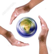 Hands around spinning earth globe