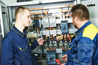 Electricians engineers near distribution box