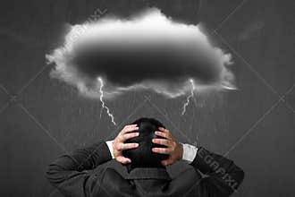 Depressed businessman with dark cloud rain lightning over his he