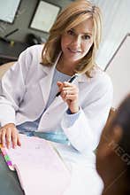 Doctor in discussion with patient in IVF clinic