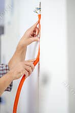 Man Installing Flexible Corrugated Cable Duct