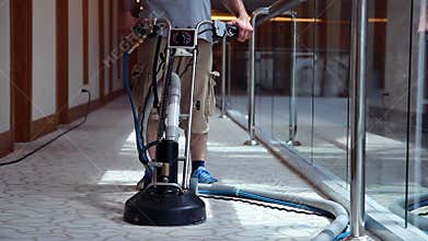 Cleaner Male Worker Cleaning Hotel Corridor Carpet