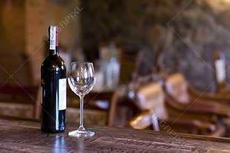 Wine and glass on the bar