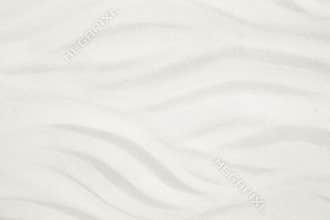 White sand beach with waves for a summer holiday background.