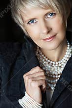 Woman in pearls in her 40s