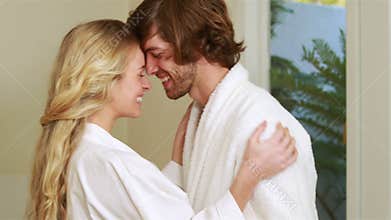 Attractive couple hugging with affection