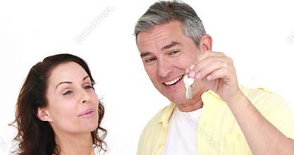 Happy attractive couple holding new house key