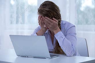 Despair cyberbullying victim covering eyes