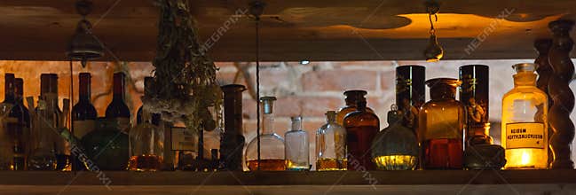 Shelf with alchemy/pharmacy bottles