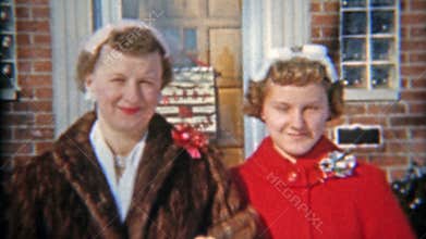 DETROIT, MICHIGAN 1957: Family leaving house for church Christmas mourning.