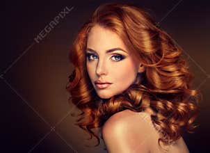 Girl model with long curly red hair.