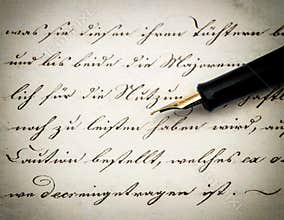 Calligraphic handwritten text and vintage ink pen. Retro style