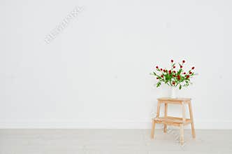 Concept of bouquet of flowers on stepladder on background whit