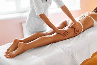 Body care. Legs massage in spa salon