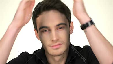 The man preens before the mirror