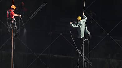Washers wash the windows of modern skyscraper