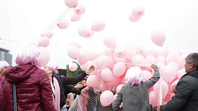 Pink balloons against breast cancer