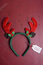 Christmas Reindeer Ears on wood background.