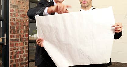 Team of architect looking at construction plan
