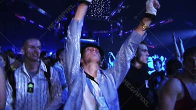 Guy in a hat and gloves, dancing on the drum and