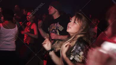 Boys and girls dancing at a party at the club
