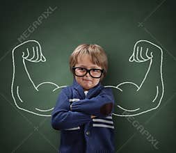 Strong man child showing bicep muscles
