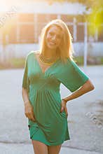 Smiling blond woman in sunlight