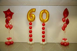 Photo holiday decorations of the stage, curtain or wall with the number 60 (sixty)