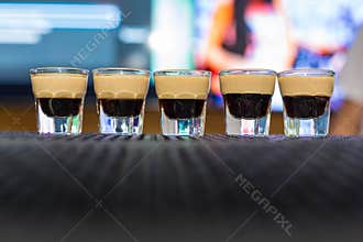 Alcohol shots on ther bar with B52 inside