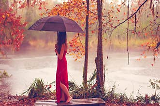 Woman in red dress with umbrella