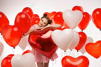 Beautiful girl, stylish fashion model with balloons in the shape