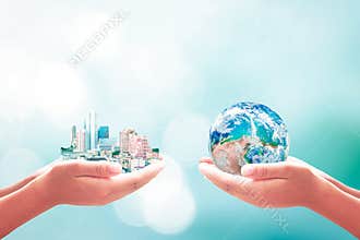 Human Hands Holding City And Planet Earth Symbol Of Global Responsibility