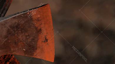 Ax blade in light of campfire