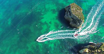 Boats sailing between the rocks aerial