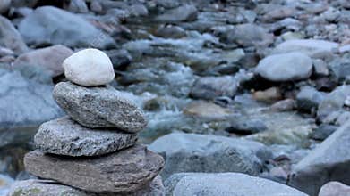 Stone cairn beside a river