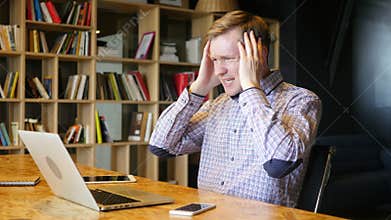 stressed online financial trader reacts as he watches the deal crash