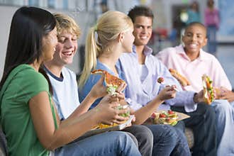 Teenagers enjoying lunch together
