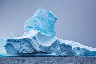 Part of the blue beautifull larger iceberg in ocean, Antarctica