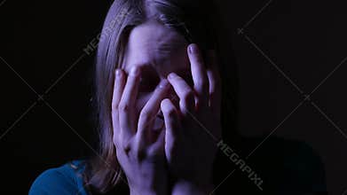 Close up of a scared and crying teen girl. 4K UHD.