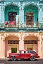 Classic vintage car and coloful colonial buildings in Old Havana