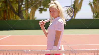 Attractive active blond woman playing tennis