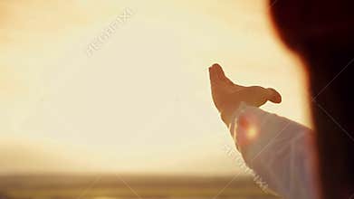 Hands of men and women at sunset