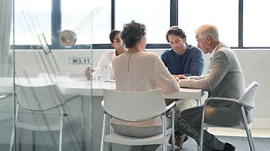 Businesswoman showing results to team