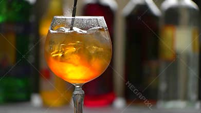 Spoon slowly mixes beverage.