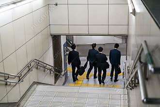Men going into the subway