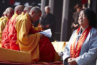 Chinese monks reading scripture in pray event