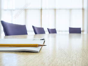 Business meeting Table with Seats Book and Pencil Board room